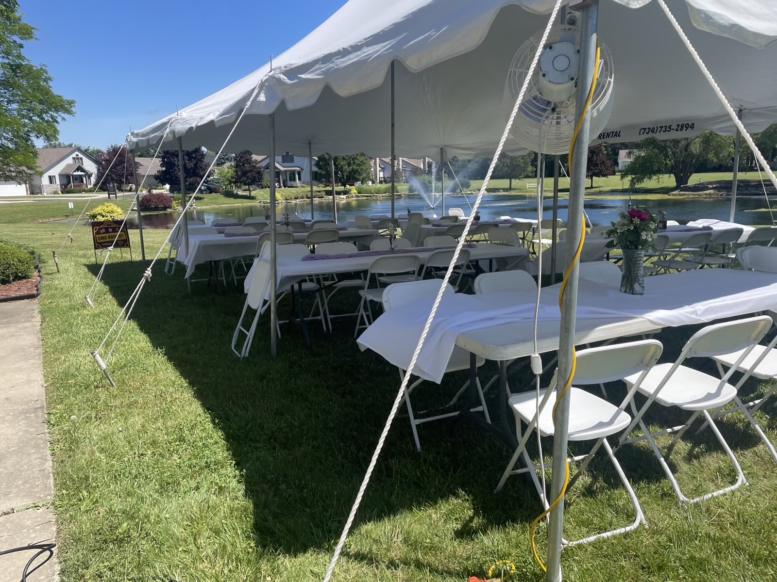 Outdoor event tent beside the pond